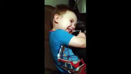 Toddler shows how much he loves his new puppy