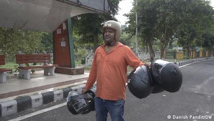 India's 'Helmet Man' gives away headgear to save lives