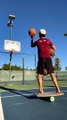 Guy Standing on Balance Board Attempts Basketball Trick Shots