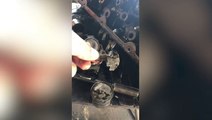 Mechanic fixing motorcycle finds beer bottle caps used in makeshift engine repair