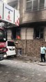 Eş ve çocuklarının olduğu evi ateşe veren kişi polis tarafından çıkarıldı