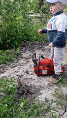 Little Man Frustrated About His Broken Chainsaw
