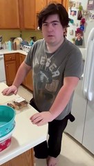 Peter tries mini Eclairs