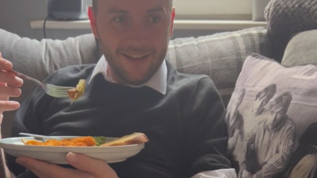 Teething baby turns into a mini dinosaur and gives his dad's leg a toothy kiss