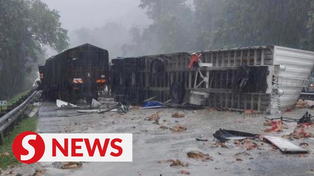 Two killed after trailer crashes through divider near Tapah