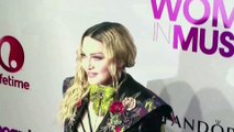 Madonna sets tour dates after hospitalization