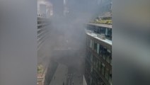 Smoke fills air near central London tube station as firefighters battle blaze in city