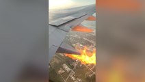 Plane passenger films flames shooting out of wing mid-flight