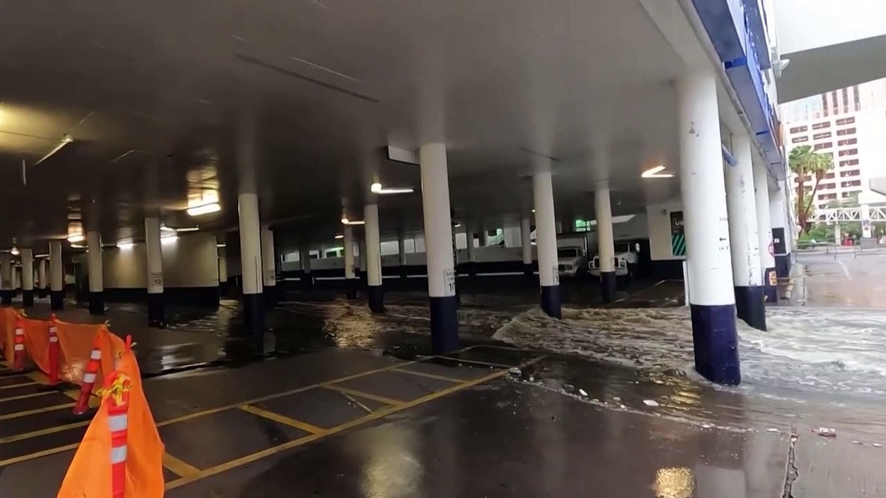 Floodwater gushes through casino parking lot as storm Hilary hits Las Vegas