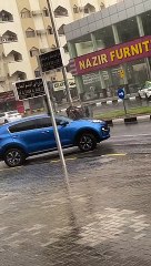 Garbage Drum Floats Down Street In Heavy Rain