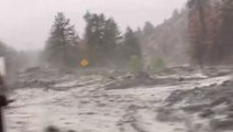 Mudflows gush down a hillside as Tropical Storm Hilary makes landfall in Southern California