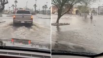 Cars drive through floodwater after Tropical Storm Hilary makes landfall in California