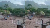 Video: Heavy rains sweep trees and cars through the streets of Chile