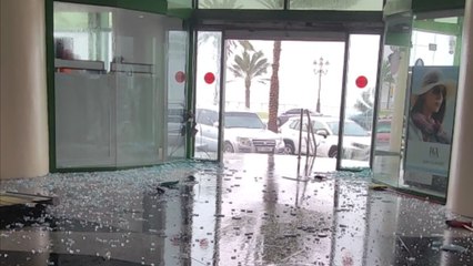 Aggressive rain storm destroys the glass front of a hotel in Sharjah, UAE