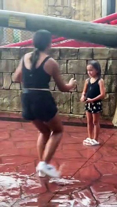 Roller Coaster Soaks Posing Bystander