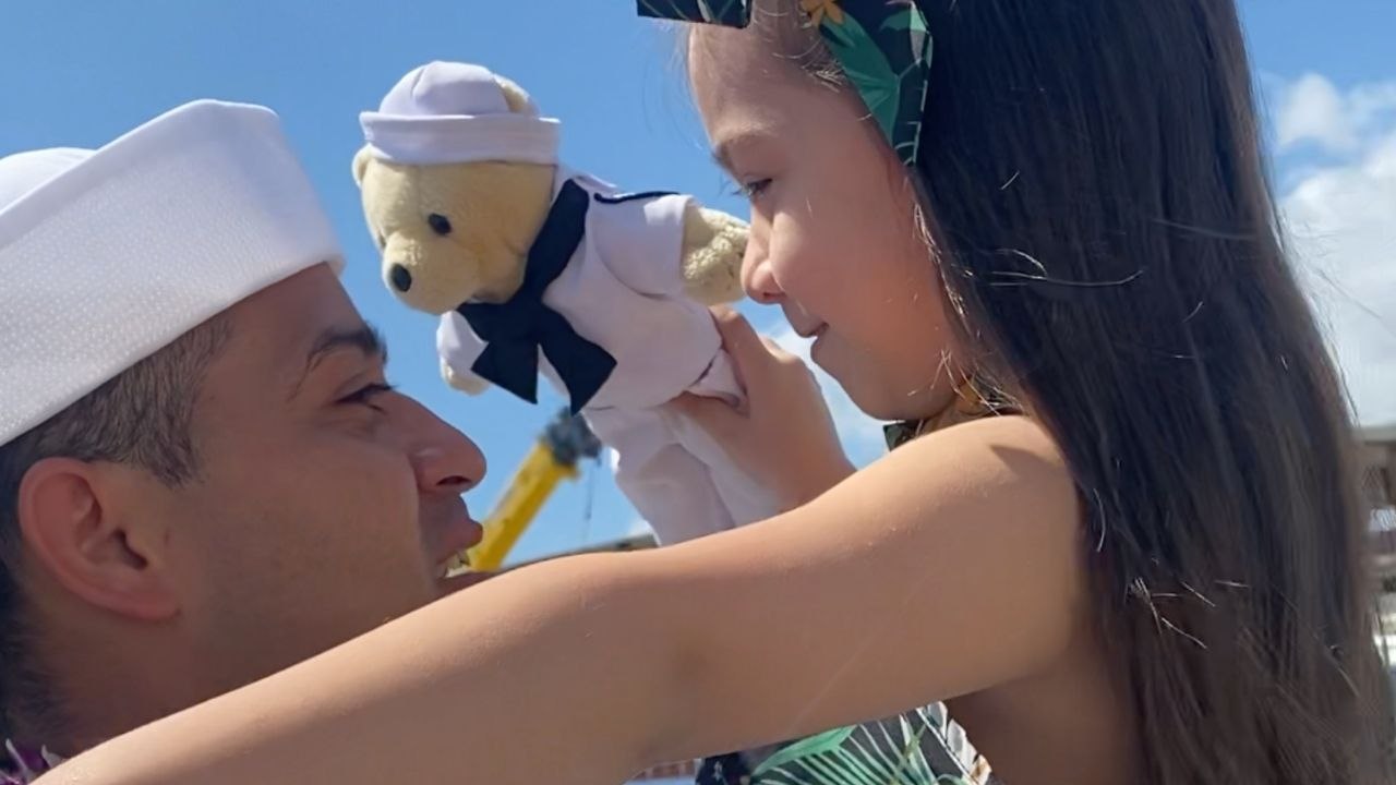 Girl With Sailor Doll Reunites With Navy Dad After His Deployment