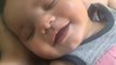 'Just look at her!' - Cute toddler melts hearts by smiling heartily in her sleep