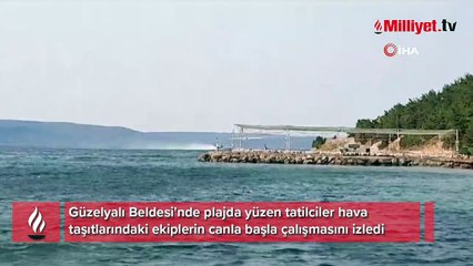 Çanakkale'de yürek sızlatan görüntü: Bir yanda yangın bir yanda deniz keyfi