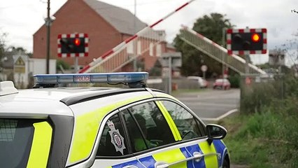 Police officer hit by train trying to save man on tracks