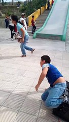 Boy on Slide Accidently Crashes Into Lady