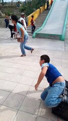 Boy on Slide Accidently Crashes Into Lady