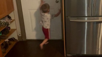 Adorable toddler squeaks and whistles dog-like to call his dogs inside the room
