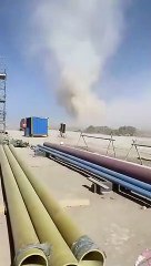 Dust Devil Sweeps Through Worksite