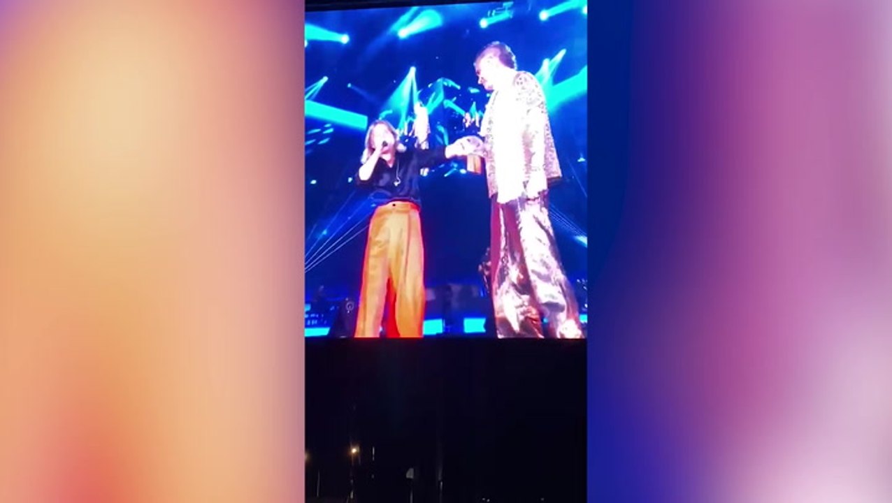 Emotional Robbie Williams and Mark Owen reunite on stage for first time in 12 years