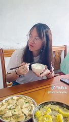Chinese husband and wife eating noodles challenge