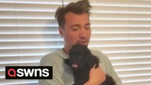 Husband has the most adorable reaction after wife surprises him with a puppy for his birthday