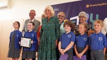 Queen joins schoolkids and grandparents for poetry recital