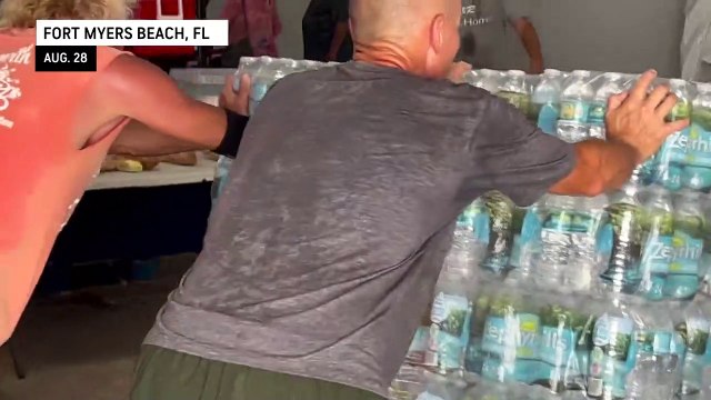 Church volunteers prepare emergency food and supplies