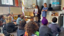 Six year-old Gillian Stewart teaches her peers Auslan