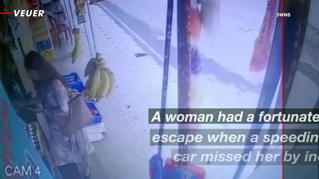 Woman Narrowly Avoids Being Hit By a Speeding Car While Shopping in India
