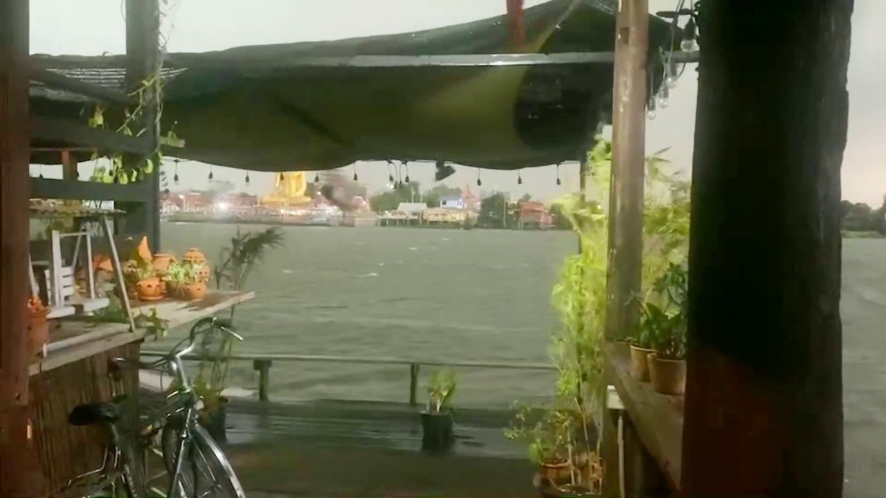 Heavy rain at Chao Phraya river Baan Hia Cafe Koh Kret Thailand