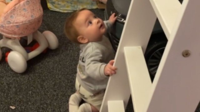 Toddler with a wicked sense of humor laughs when his sister falls down a slide