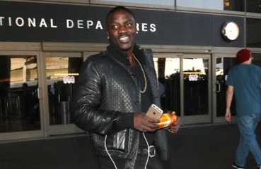 Akon felt pressure to "distance" himself from his African background at the start of his career