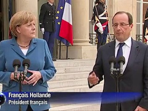 Merkel et Hollande se concertent à la veille du sommet européen, l'Espagne vacille
