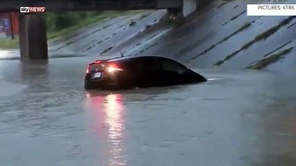Reporter Steve Campion rescues man trapped in high water on