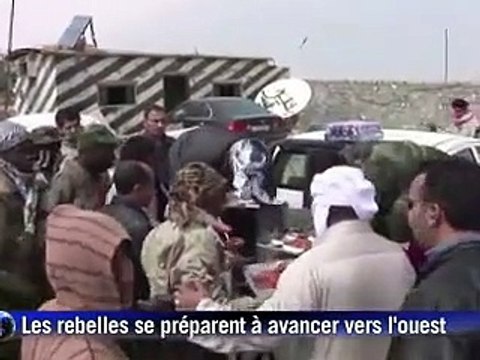 Libye: tirs nourris dans le centre de Tripoli, Kadhafi menace