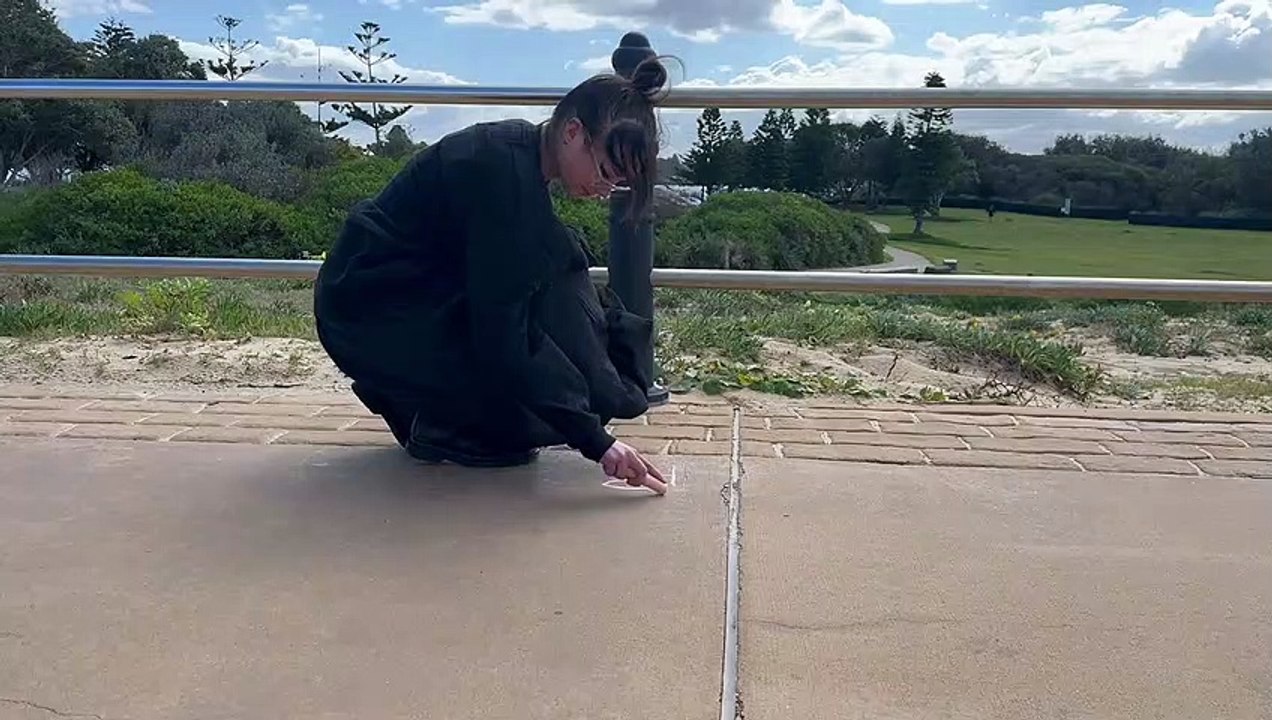Tia Hinton comes forward as Newcastle artist behind Nobbys Beach chalk affirmations | Newcastle Herald | September 1, 2023