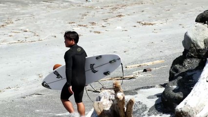 Beautiful Surfer Riding the Waves in Niijima, a Beautiful Resort in Japan