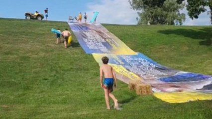 Woman gets involved in 'wristy' business following EPIC slip-n-slide misadventure