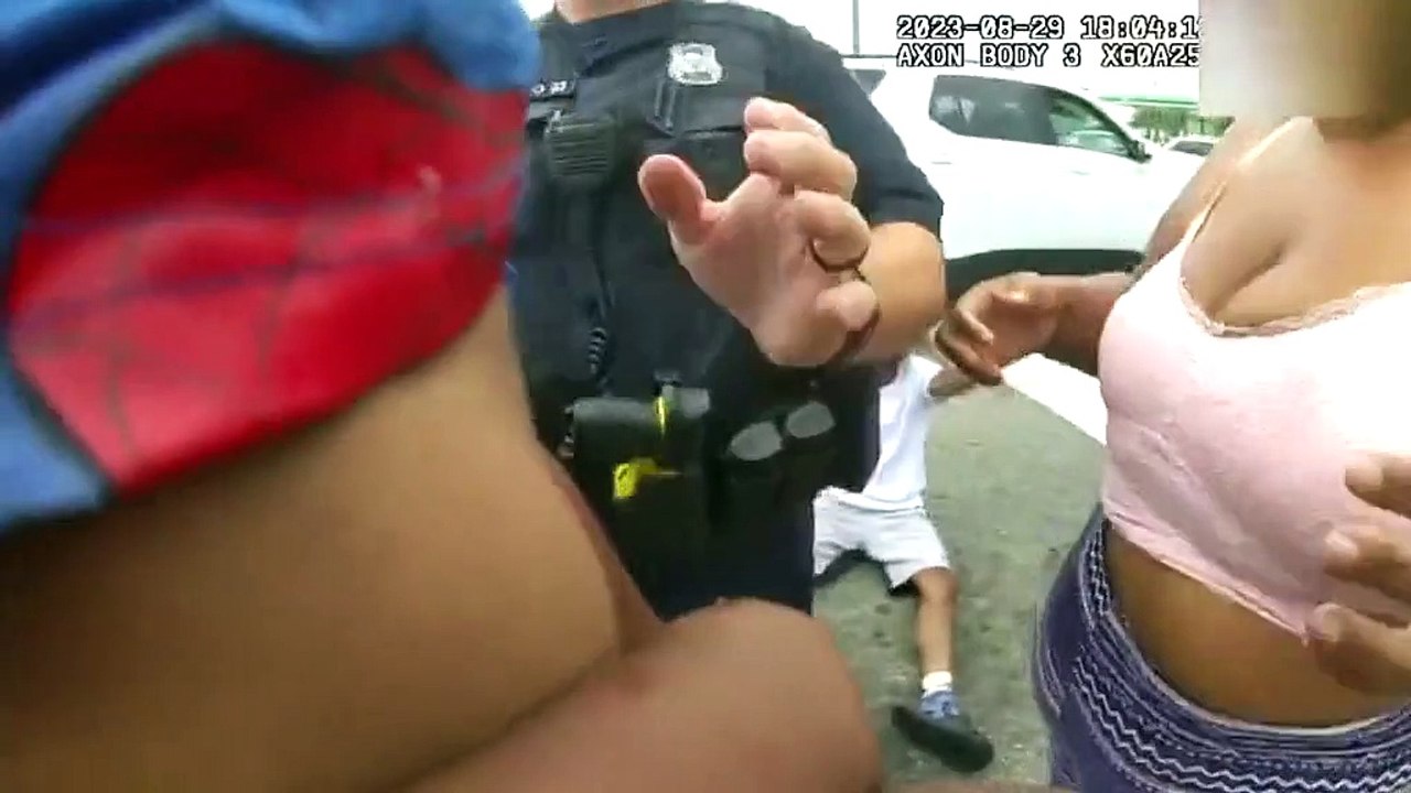 Astonishing moment hero cop resuscitates baby in the middle of a busy highway after his mom sped past patrol car on the way to the hospital