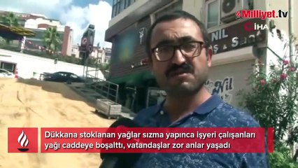 Dükkan sahibi içeri sızan yağları caddeye boşaltınca ilginç görüntüler ortaya çıktı