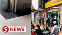 Three hurt in bank after auxiliary cop accidentally discharges gun