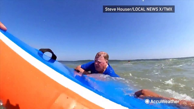 Surfer rescues man from a rip current near the Jersey Shore