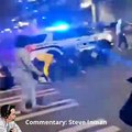 Rioters trying to block a Cop