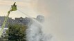 100 firefighters battle blaze at waste centre in London