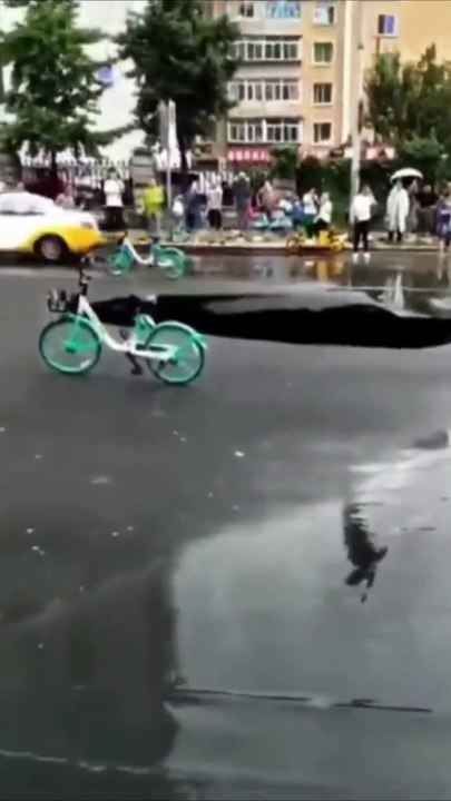 Terrifying Scene: Cars Plunged into Massive Sinkhole!